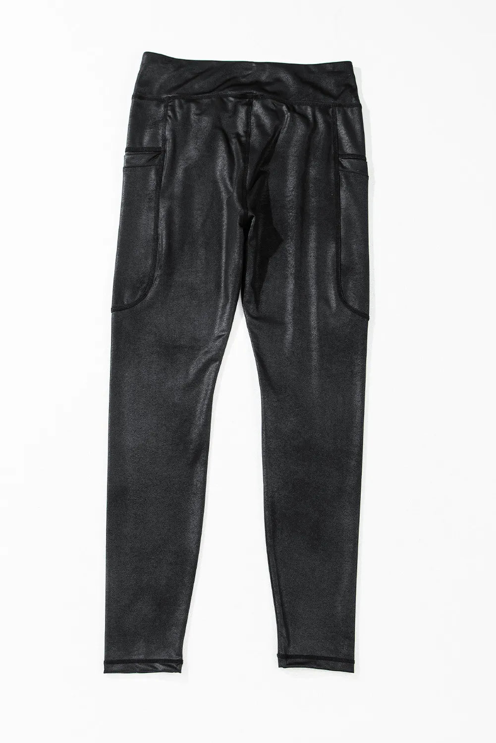 Black faux leather leggings with textured finish and side pockets.