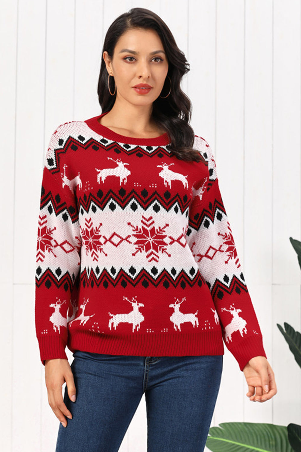 Red acrylic sweater with reindeer and snowflake Fair Isle pattern, crew neck, long sleeves.