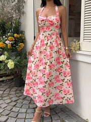 Romantic floral halter midi dress with a-line cut and sweetheart neckline.