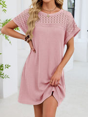 Blush pink t-shirt dress with sheer lace yoke and short sleeves, above the knee length.