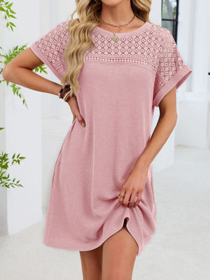 Blush pink t-shirt dress with sheer lace yoke and short sleeves, above the knee length.