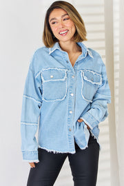 Light wash denim overshirt with frayed details and chest pockets.