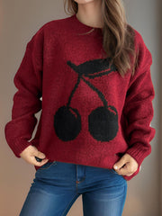 Burgundy knit sweater with black cherry motif, crew neck, long sleeves.