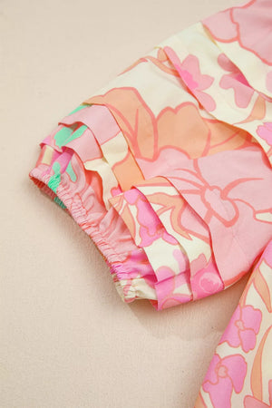Short sleeve cotton shirt with retro floral pattern, tiered sleeve detail, and elastic cuff.