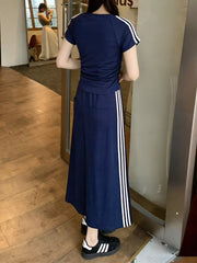 Dark blue midi skirt suit with white stripes on the side and matching tee.