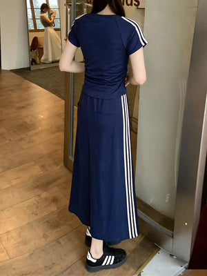 Dark blue midi skirt suit with white stripes on the side and matching tee.