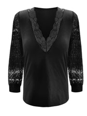 Black lace inset v-neck blouse with blouson sleeves.