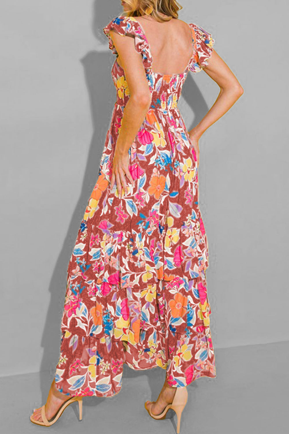 Floral ruffle-sleeve tiered midi dress with a smocked bodice and vibrant floral print.