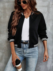 Black quilted bomber jacket with striped ribbing at collar, cuffs, and hem.
