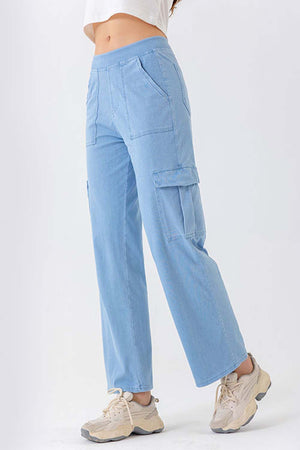 Light wash denim cargo pants with multiple pockets and a relaxed fit.