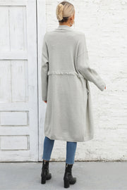 Light Gray longline knit cardigan with fringe trim detail.