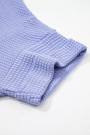 Relaxed V-neck waffle knit t-shirt in Blue Purple with cuffed sleeves.