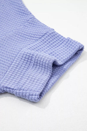 Relaxed V-neck waffle knit t-shirt in Blue Purple with cuffed sleeves.