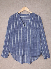 Dusty blue striped V-neck buttoned blouse with long sleeves and a curved hem.