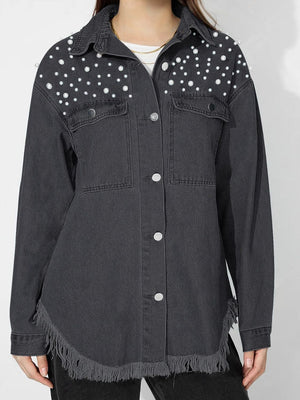 Dark denim shirt with pearl embellishments on shoulders, frayed hem, and collar.