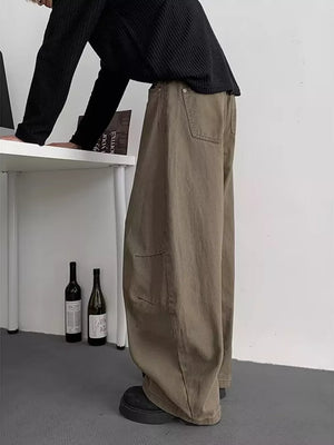 Earthy brown men's baggy sweatpants with pockets and a relaxed fit.