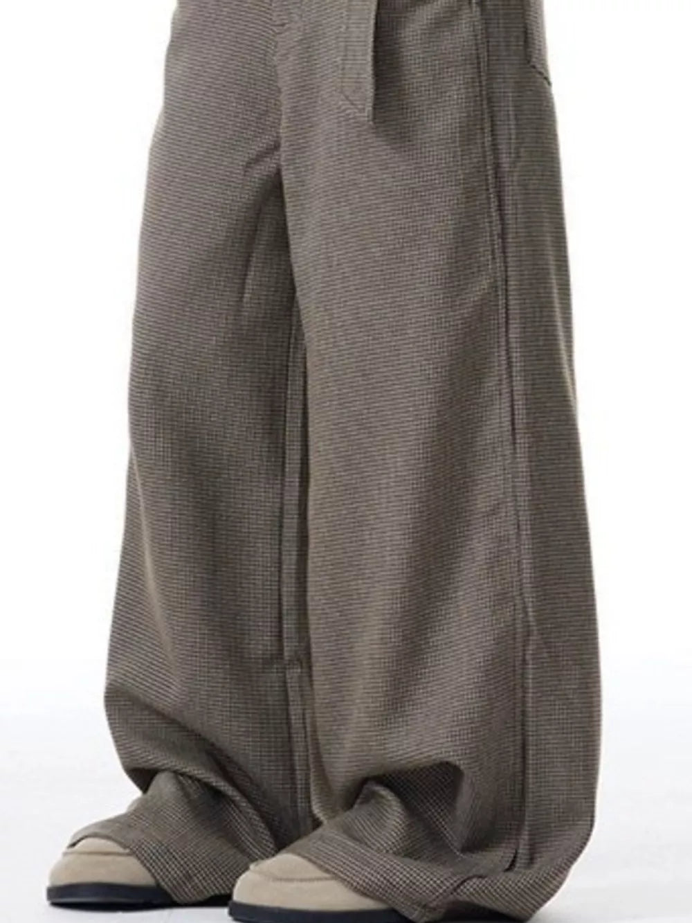 Contemporary wide-leg sweatpants with pockets in a subtle check pattern.