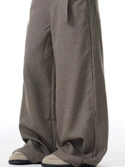 Contemporary wide-leg sweatpants with pockets in a subtle check pattern.
