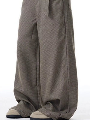Contemporary wide-leg sweatpants with pockets in a subtle check pattern.