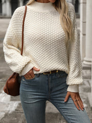 Textured mock-neck sweater in white with long sleeves and a relaxed fit.