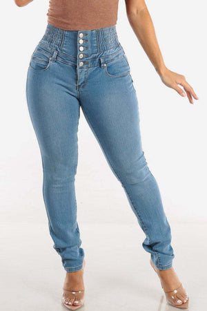 Light wash denim skinny jeans with a sculpted, button-fly waistband.