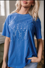 Blue oversized graphic t-shirt with "MOTHERHOOD" text, crew neck, short sleeves.
