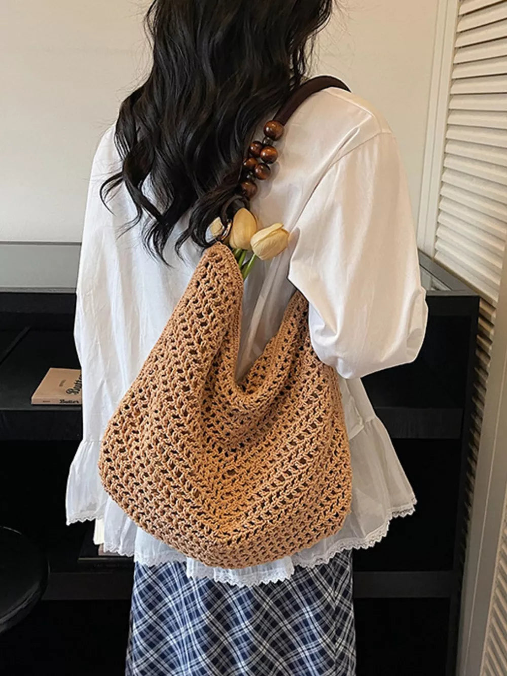 Khaki textured knit shoulder bag with bead handle and crochet detail.