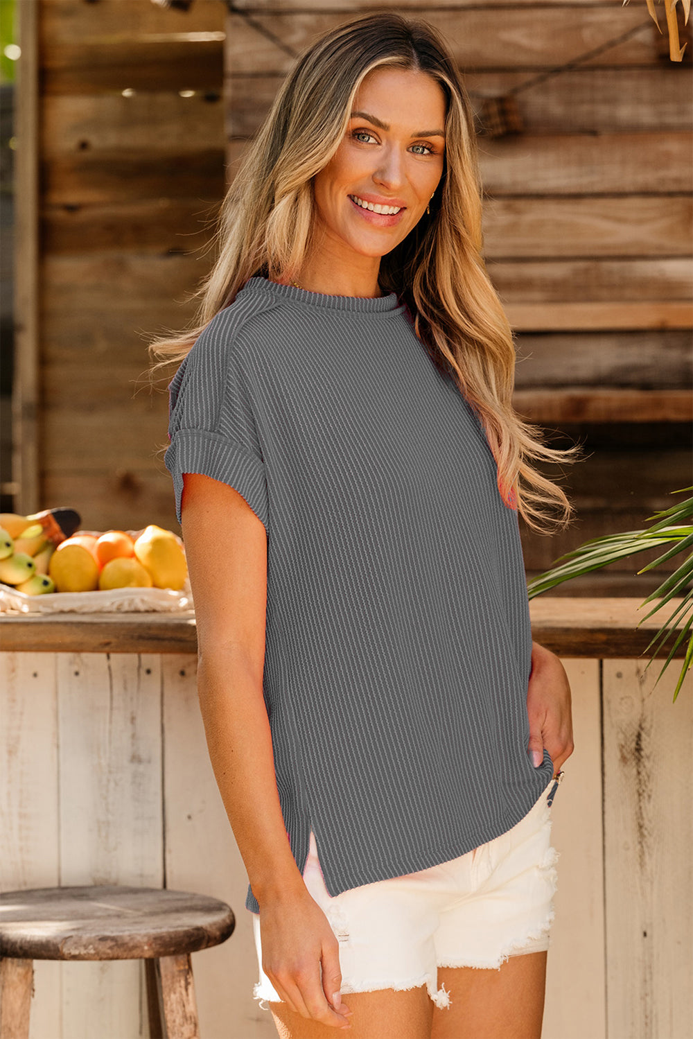 Textured ribbed tee in dark gray with rolled sleeves and a relaxed fit.