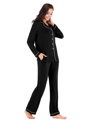 Black piped trim pajama set with pockets and long sleeves.