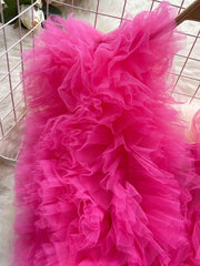 Ruffled pink bodysuit with V-neck and lace detail