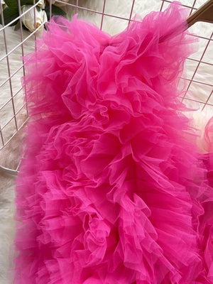 Ruffled pink bodysuit with V-neck and lace detail