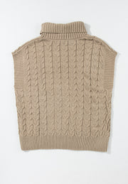 Khaki cable knit turtleneck capelet sweater with ribbed trim and short sleeves.