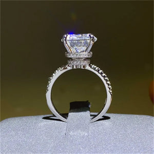 Sterling silver ring with a large solitaire diamond and pave band.