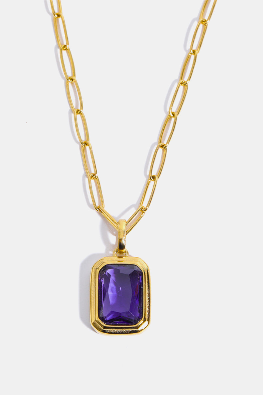 Gilded Prism Pendant Necklace with purple gemstone and 18K gold chain.