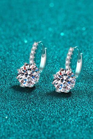 Sterling silver hoop earrings with moissanite halo and center stone.