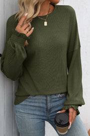 Army green ribbed knit blouse with ruffled cuffs and crew neck.