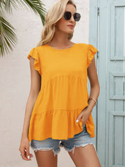 Orange-red babydoll blouse with ruffled short sleeves and tiered hem.