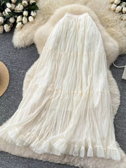 Elegant tiered tulle skirt in ivory with ruffled hem and gathered details.