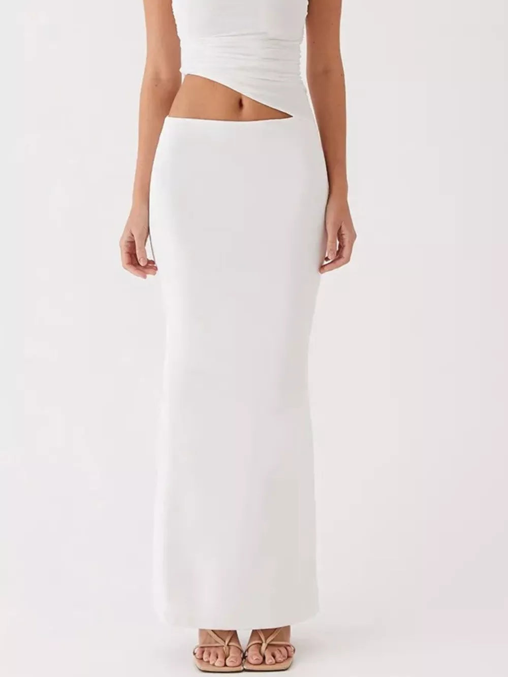 White one-shoulder cutout maxi maternity dress with a ruched bodice detail.