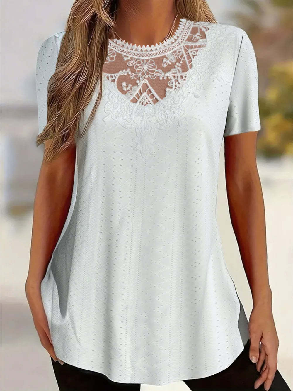 White eyelet maternity t-shirt with delicate lace yoke and short sleeves.