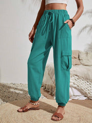 Turquoise textured cargo lounge trousers with drawstring waist and elastic cuffs.
