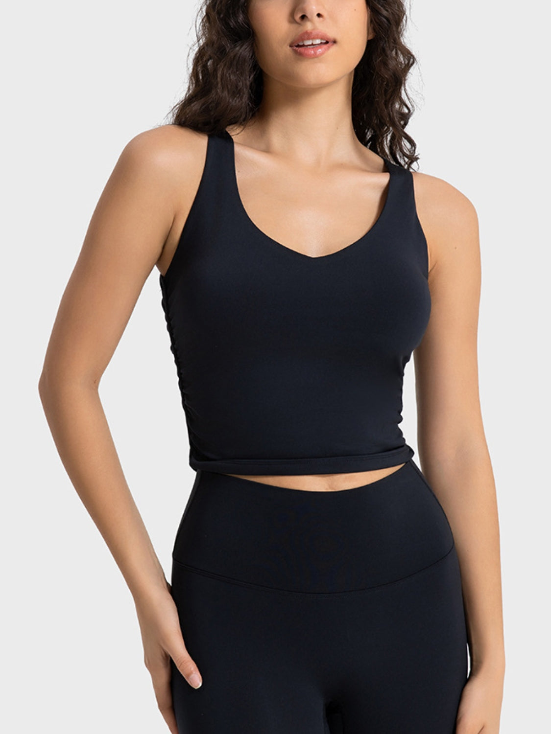 Black sculpted ruched tank top with V-neck and athletic fit