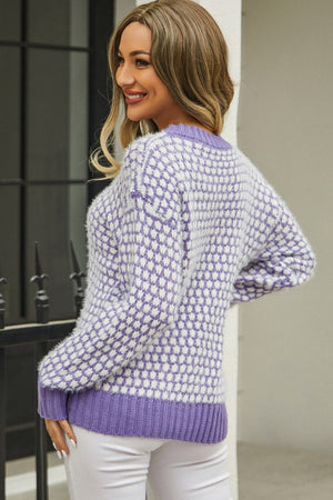 Lavender and white bouclé knit sweater with a diamond pattern and contrast trim.