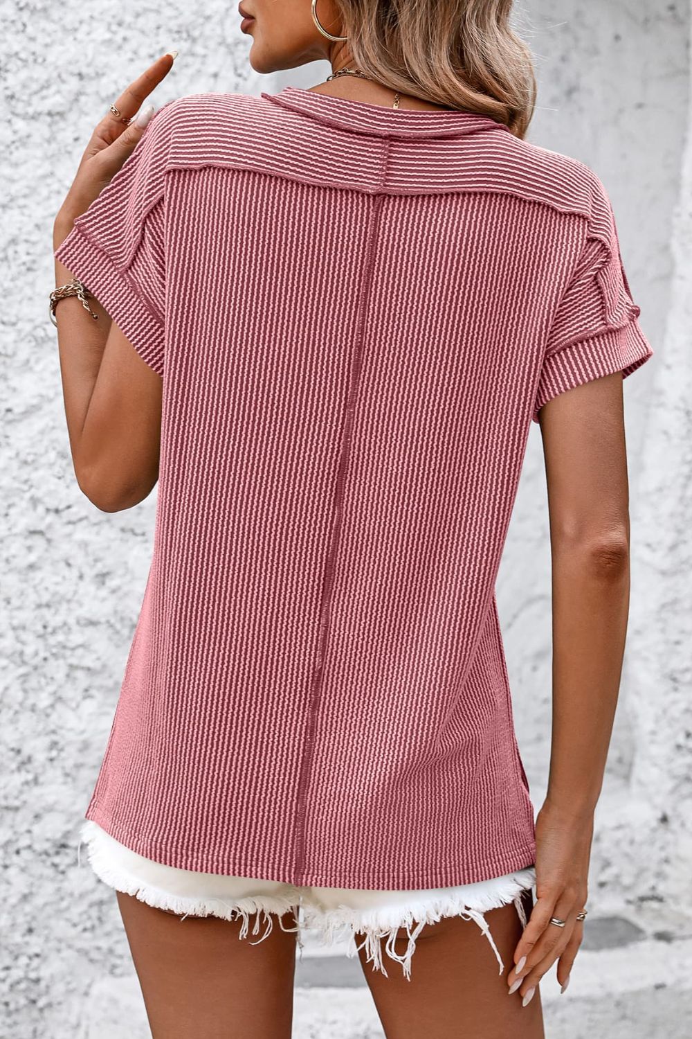 Deep Rose vertical ribbed tunic tee with short sleeves and split hem detail.