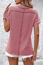 Deep Rose vertical ribbed tunic tee with short sleeves and split hem detail.