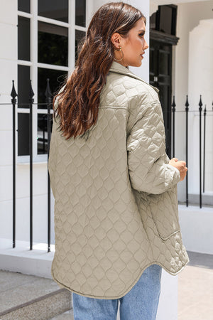 Quilted utility jacket in camel with diamond stitching and button pockets.