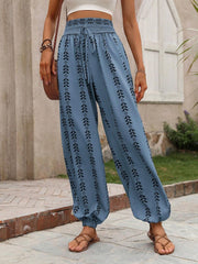 Indigo leaf print gathered ankle trousers in cerulean with a smocked waist and drawstring.