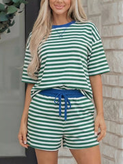 Green and white striped cotton boxy tee and shorts set with blue trim and drawstring shorts.