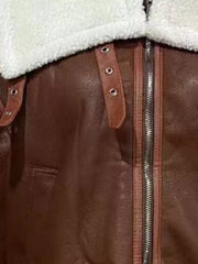 Brown shearling lined zip up jacket with leather details and buckles.