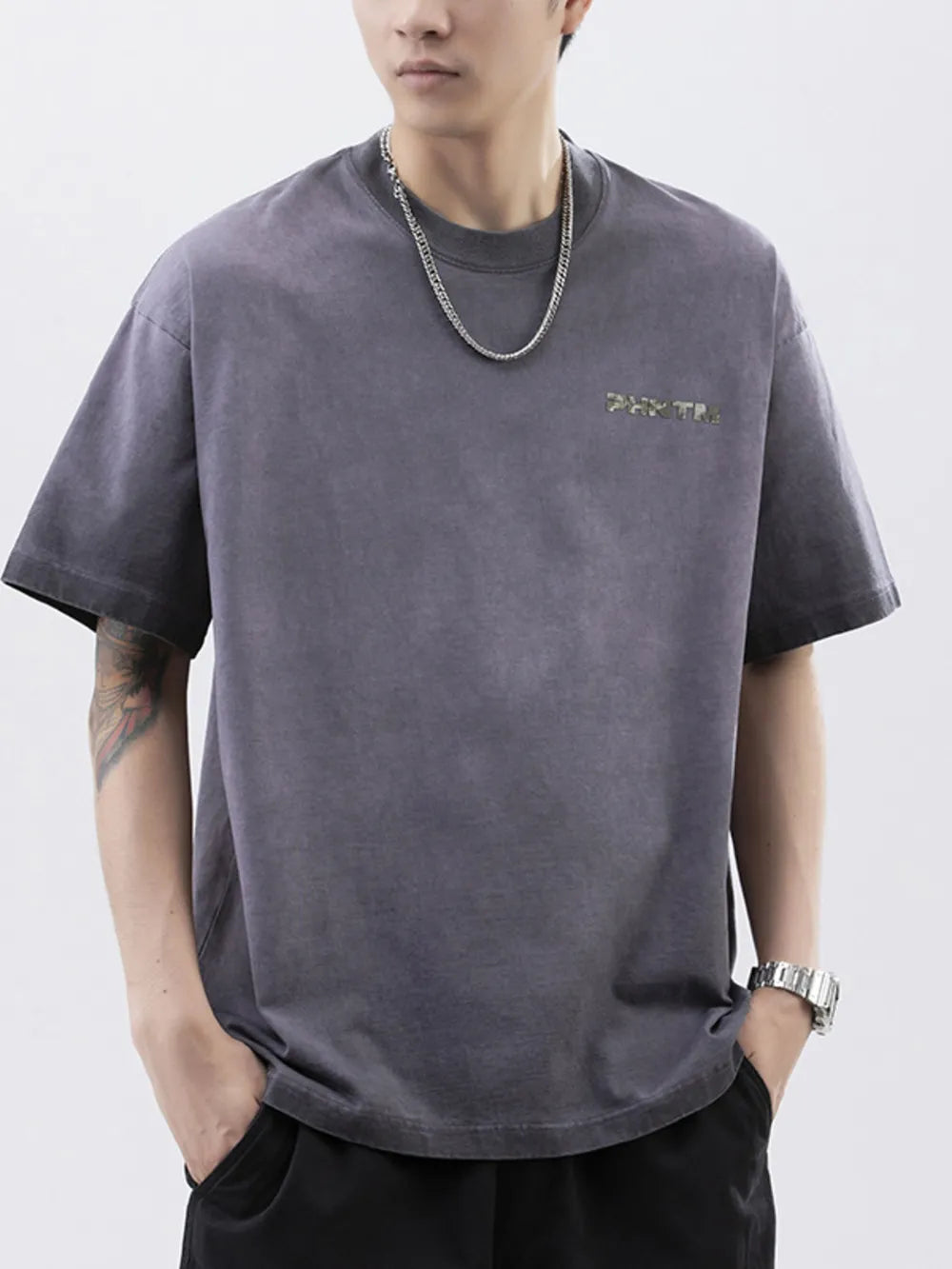 Men's dark gray cotton t-shirt with a faded wash and subtle front lettering.